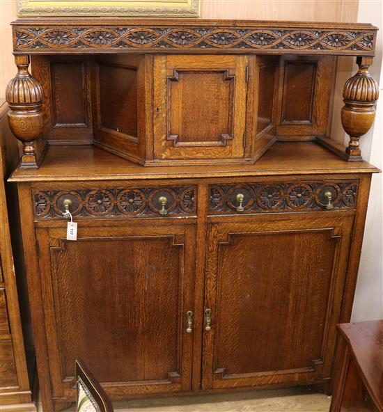 A 1920s oak court cupboard W.137cm